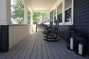 Covered front porch renovated in gray Trex composite decking