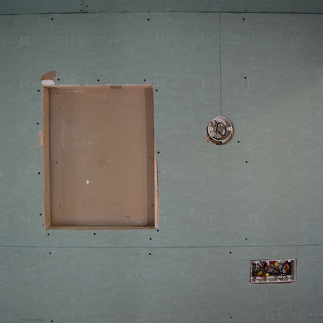 A progress photo of a vanity area of a budget accessible bathroom renovation