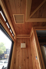 Custom wooden interior contrast trim paneling and vent cover carpentry by Elite Renovation Rhode Island