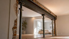 Steel beam supported during wall removal