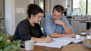 Homeowners reviewing a renovation contingency estimate