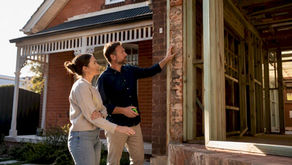 Homeowner inspecting Melbourne extension with builder