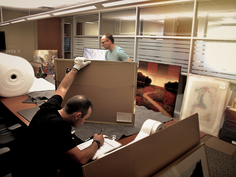 Each work is examined, measured, catalogued and inventoried prior to being wrapped and carefully stored