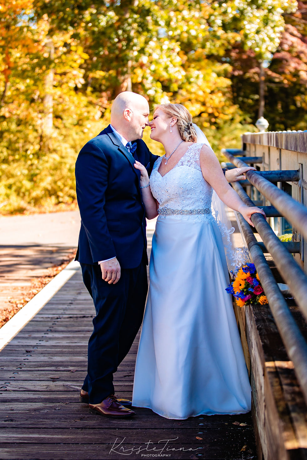 newlyweds kiss bridge