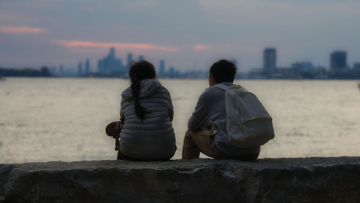 the young couple, sunset at waters edge.jpeg