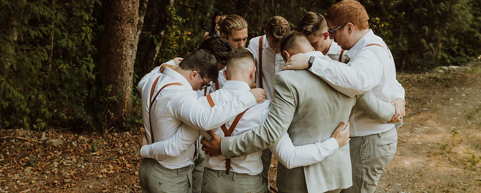 the groom group holding each other