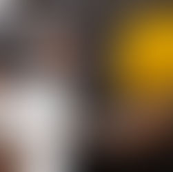 People discussing contractors application, one holding a yellow hard hat