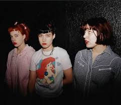 Kathleen Hanna (centre) and Tobi Vail (right), with Kathi Wilcox - Bikini Kill