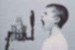 young boy hollering into a microphone