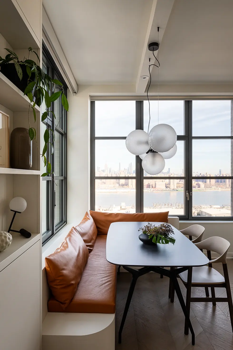 Studio Ocra Dumbo apartment renovation NYC view banquette dining area