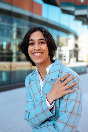 I am a queer, Black, nonbinary photographer and creative from Des Moines. As an LGBTQIA+ and BIPOC focused photographer, I am deeply passionate about validating, uplifting, and empowering members of these communities!