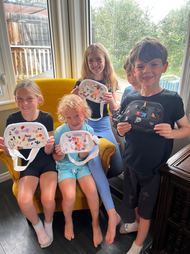 Kids holding unique bedazzled fanny packs at a BeDazzled by Linzy birthday party in Calgary