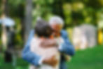 Father embracing bride at wedding