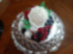Small dessert with white flower and fresh berries