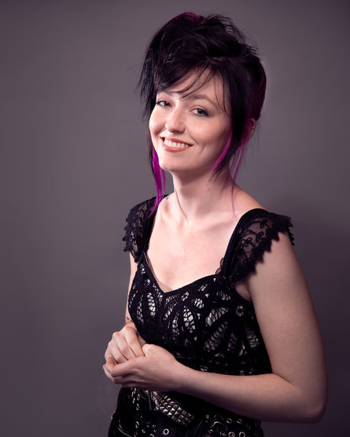 Studio portrait of singer songwriter Callum playfully laughing shot in Baltimore.