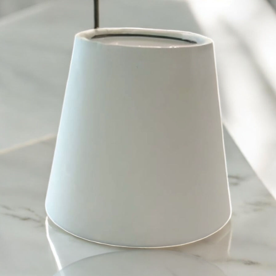 White cotton rag paper lampshade on marble surface