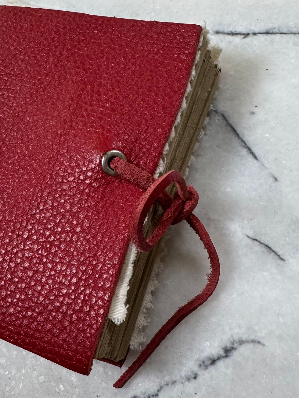 Thumbnail: Red leather journal with handcrafted details
