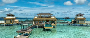 Sunset view from water villa deck Angsana Velavaru