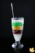 Pandan jelly, coconut jelly and red bean in coconut syrup on ice