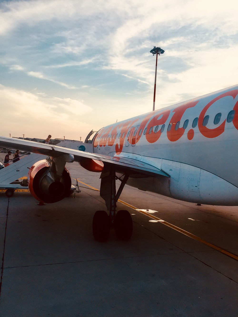Boarding easy jet plane at sunset