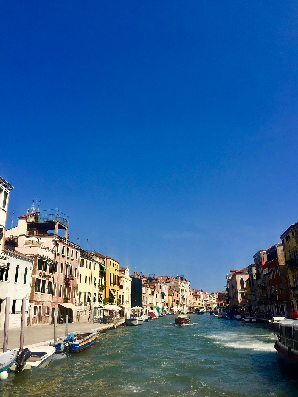 View from boat leaving Venice Italy in the summer on the Grand Canal