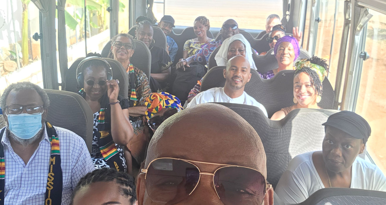Happy group riding in a bus