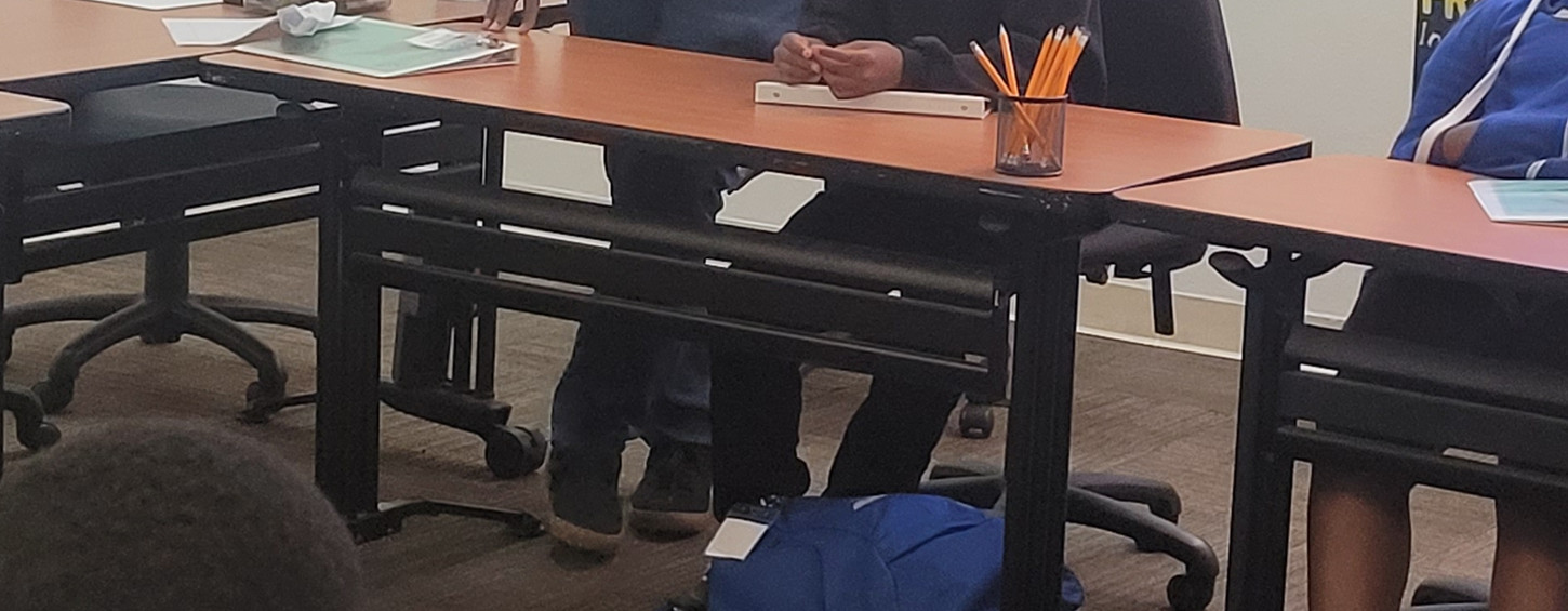 Teacher assisting students in classroom