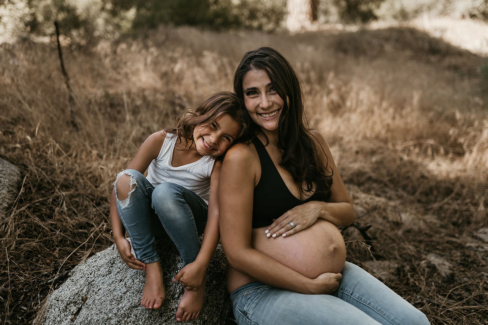 professional outdoor natural light warm moody woodsie maternity photography