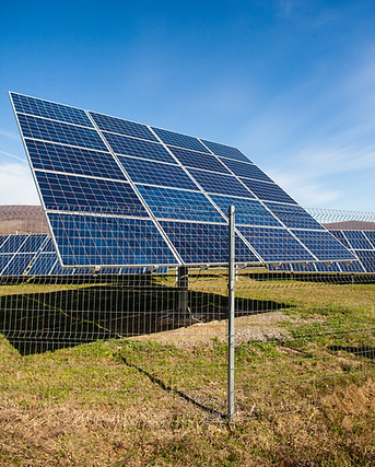 solar-panels-against-mountains-landscape-and-blue-sky.jpg