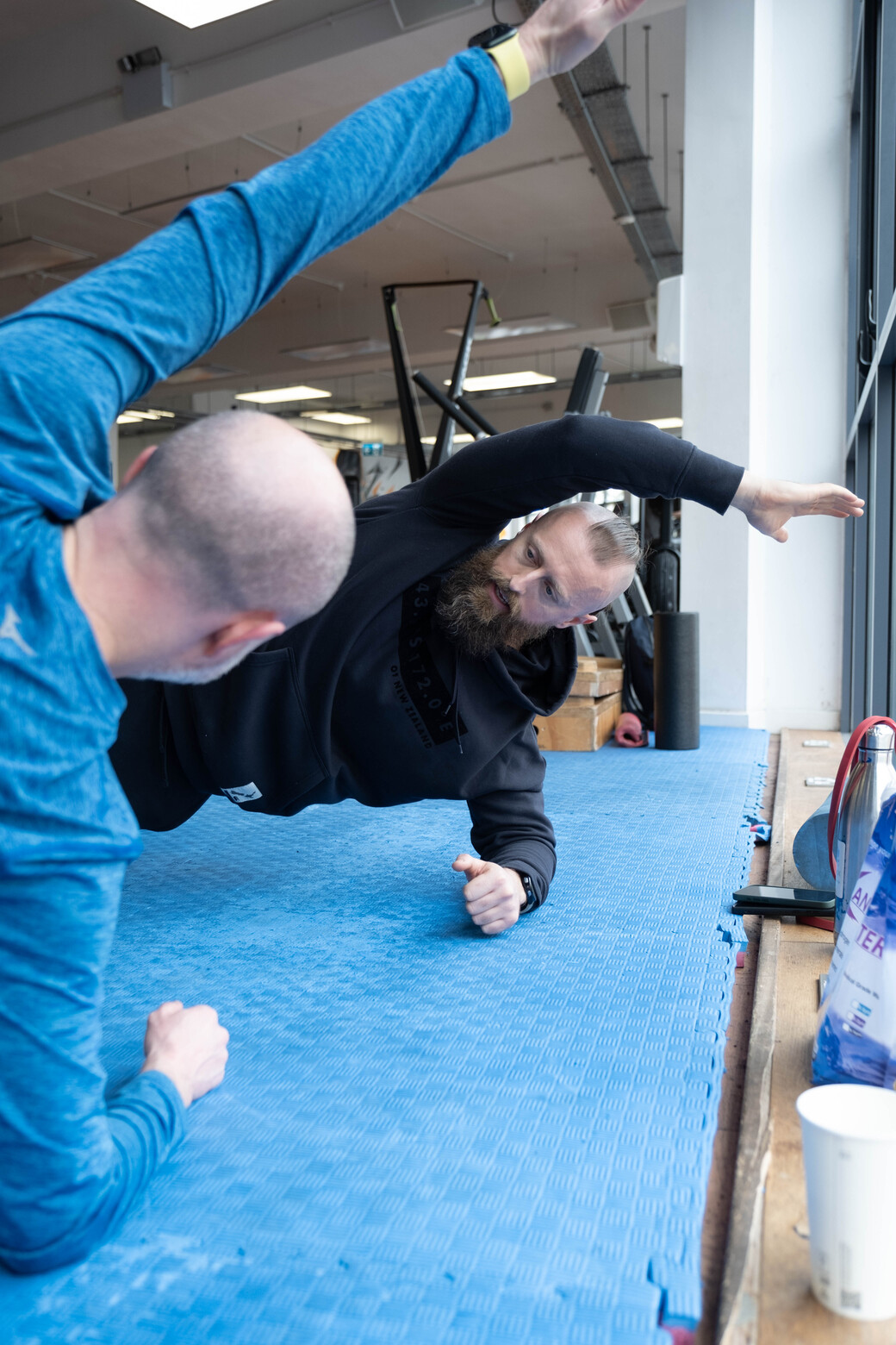 Coaching a side plank with client
