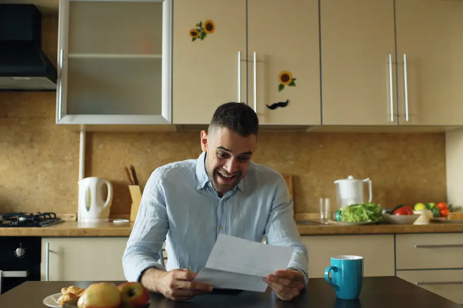 Homeowner reading mortgage renewal letter at kitchen table