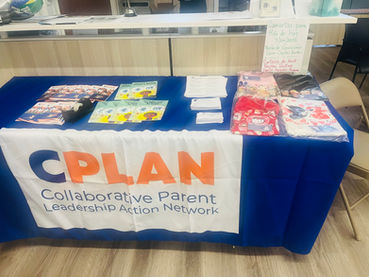 Table pictured with CPLAN logo, resources to support parent advocacy, books for children, and business cards