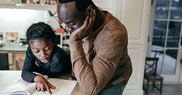 black man homeschooling son.jpeg