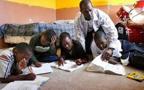 black dad homeschooling teen sons.jpeg
