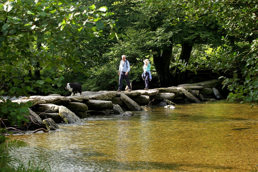 Couple crossing Tarr's steps, Exmoor