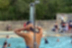 A woman using the showers at Cleveland Pools