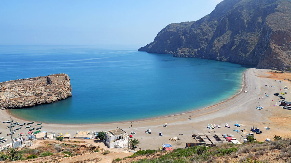 Sweeping bay with mountains in distance