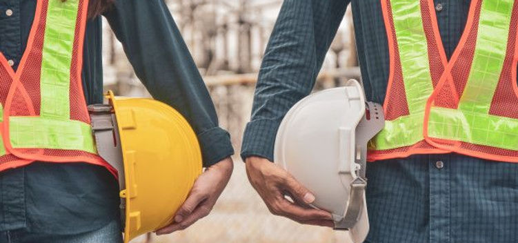 Premium Photo _ Construction engineers with hard hats (1).jpeg