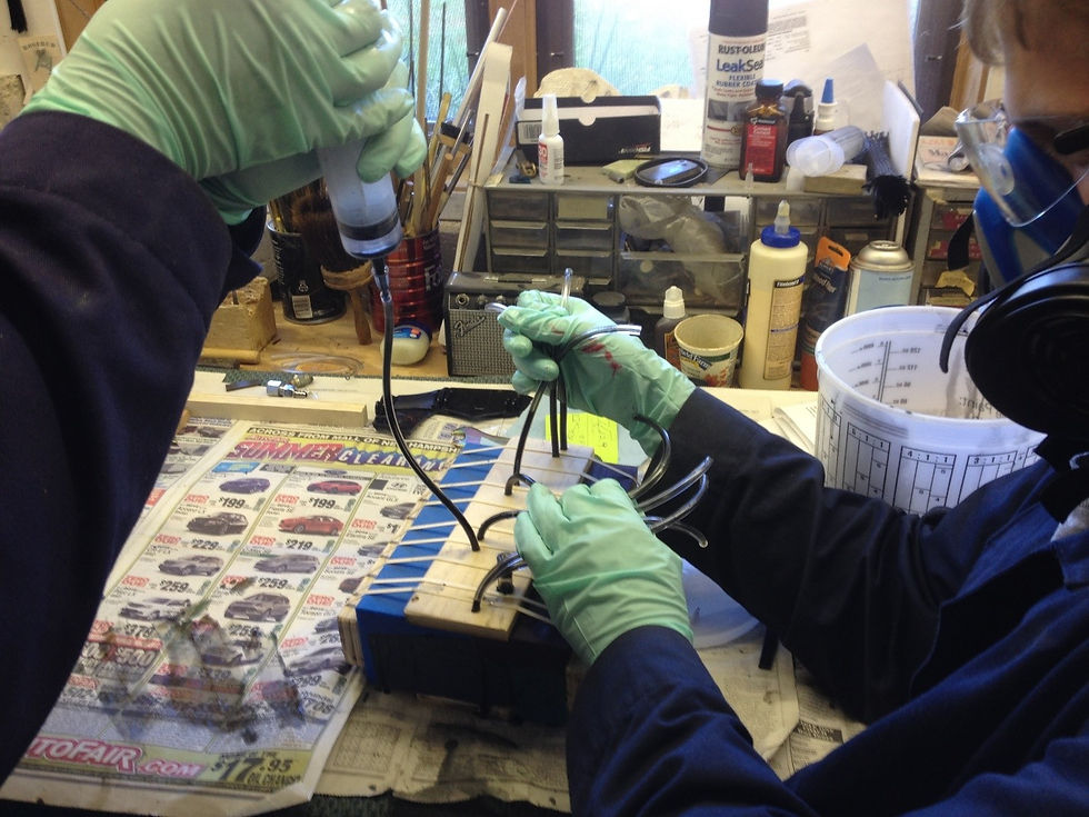 A hydroponic syringe is used to inject the mixed and de-gassed epoxy into the bridge mold