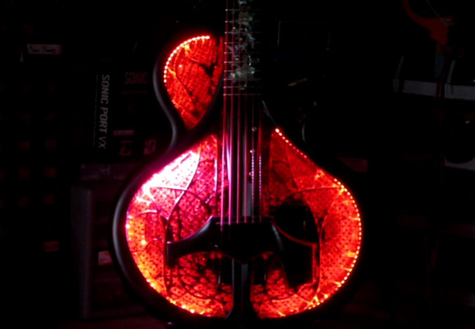 A Ridgewing guitar with prototype light show installed. This still-frame image was taken as a bright line of white circling LEDs reached the 10 o'clock position.