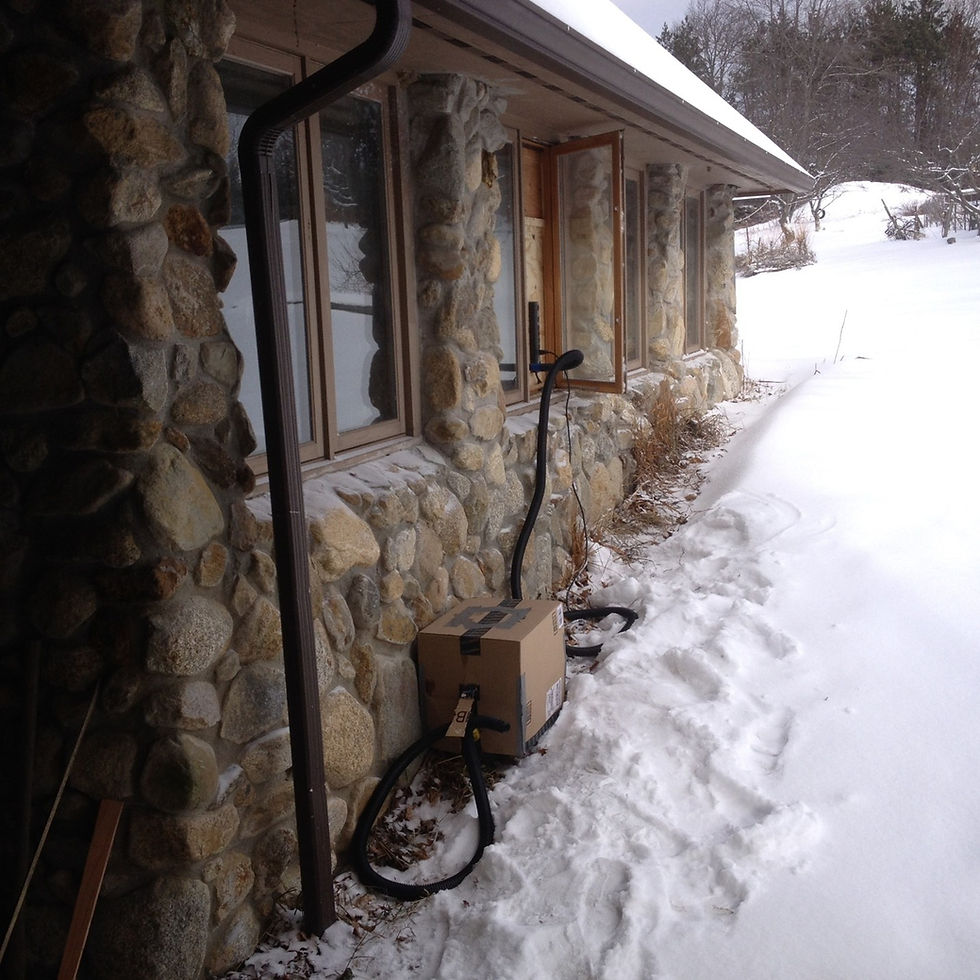 The Ridgewing shop in winter. A shop vac system is seen, protected inside a cardboard box.