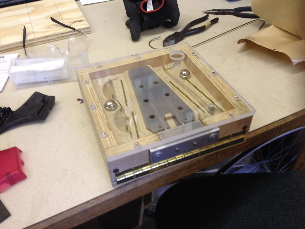 This mold makes all of the parts of a headstock in a single operation, including molding in the headstock dowels.