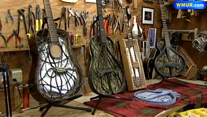 Shop bench with a Chrysalis guitar next to several older prototype guitars