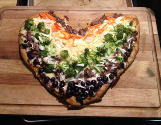 Pizza with garden grown vegetables and blueberries