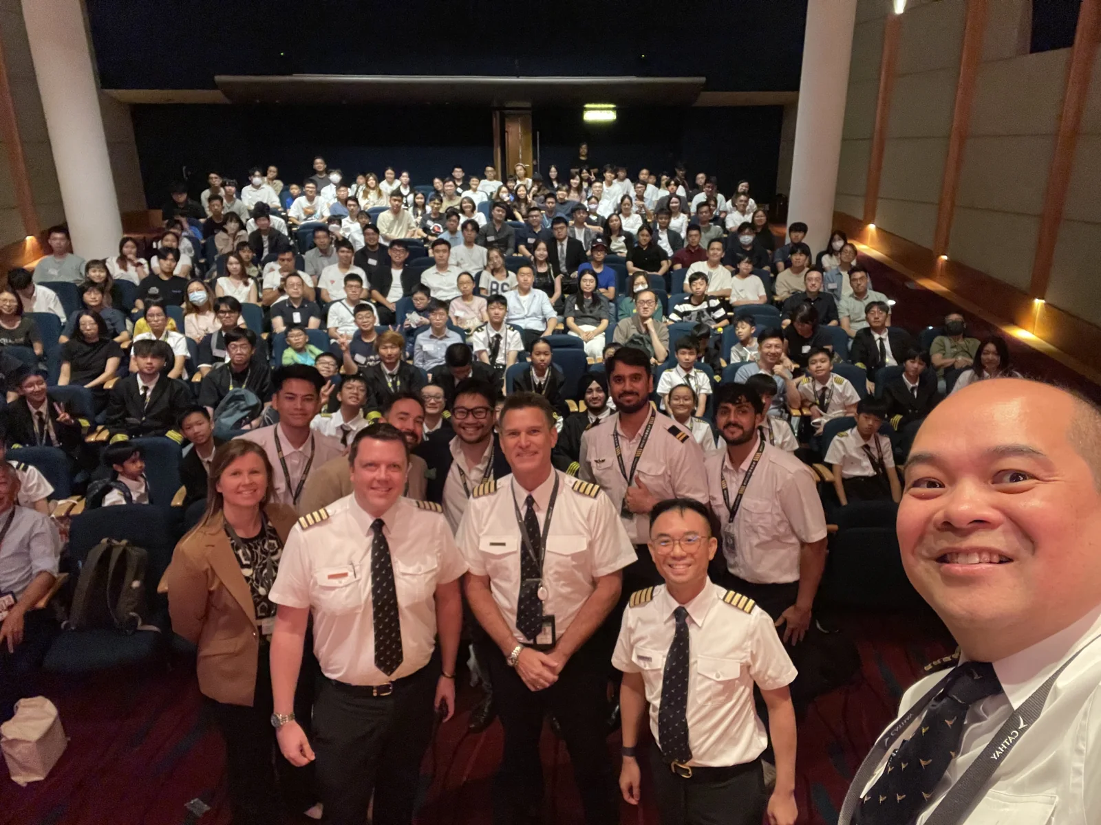 Group photograph of the HKPAPA × HONCAP Kai Tak centenary seminar, with pilots and participants in Cathay’s auditorium.