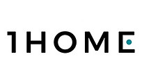 Das 1Home-Logo zeigt den Schriftzug "1HOME" in schwarzen Großbuchstaben. Das "E" am Ende hat einen kleinen türkisfarbenen Punkt im oberen Bereich des Buchstabens, der an ein Auge erinnert. Der Hintergrund ist weiß.