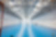 Construction workers inspecting a brand new rubber flooring coated with epoxy resin in an