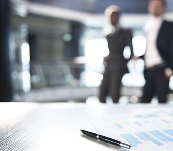 Documents and Blurred Business Men