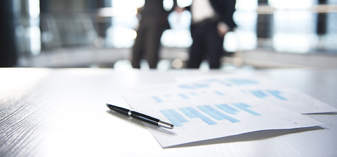 Documents and Blurred Business Men