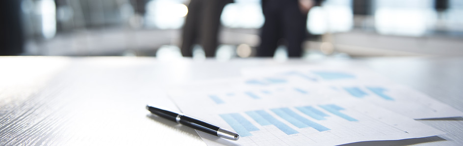 Documents and Blurred Business Men